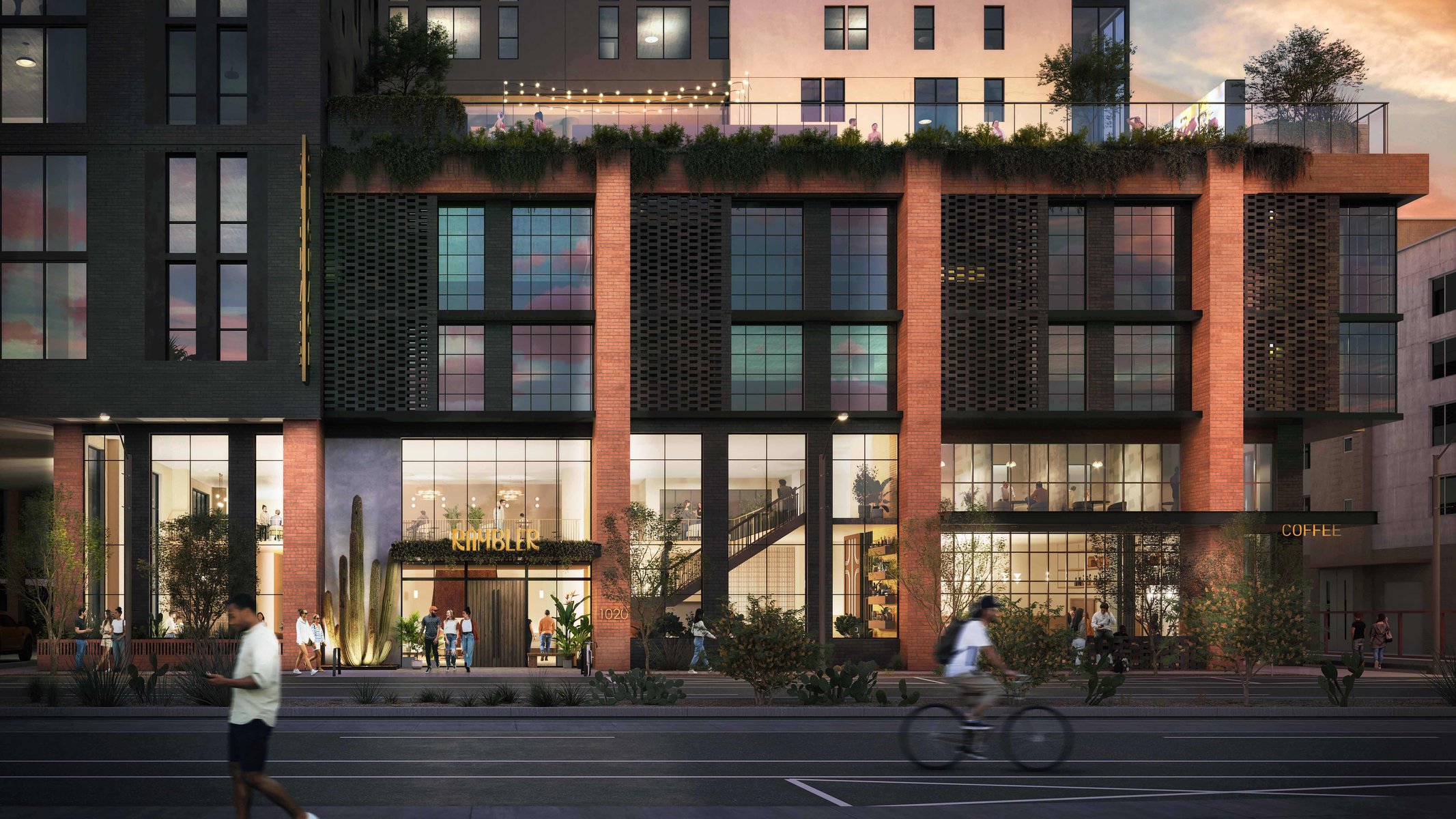 Architectural evening rendering of a mixed-use building with brick and dark metal facade, a rooftop terrace with string lights and greenery, ground-floor retail including a coffee shop, and an entrance marquee reading RAMBLER at address 1020, with pedestrians and a cyclist in the foreground.