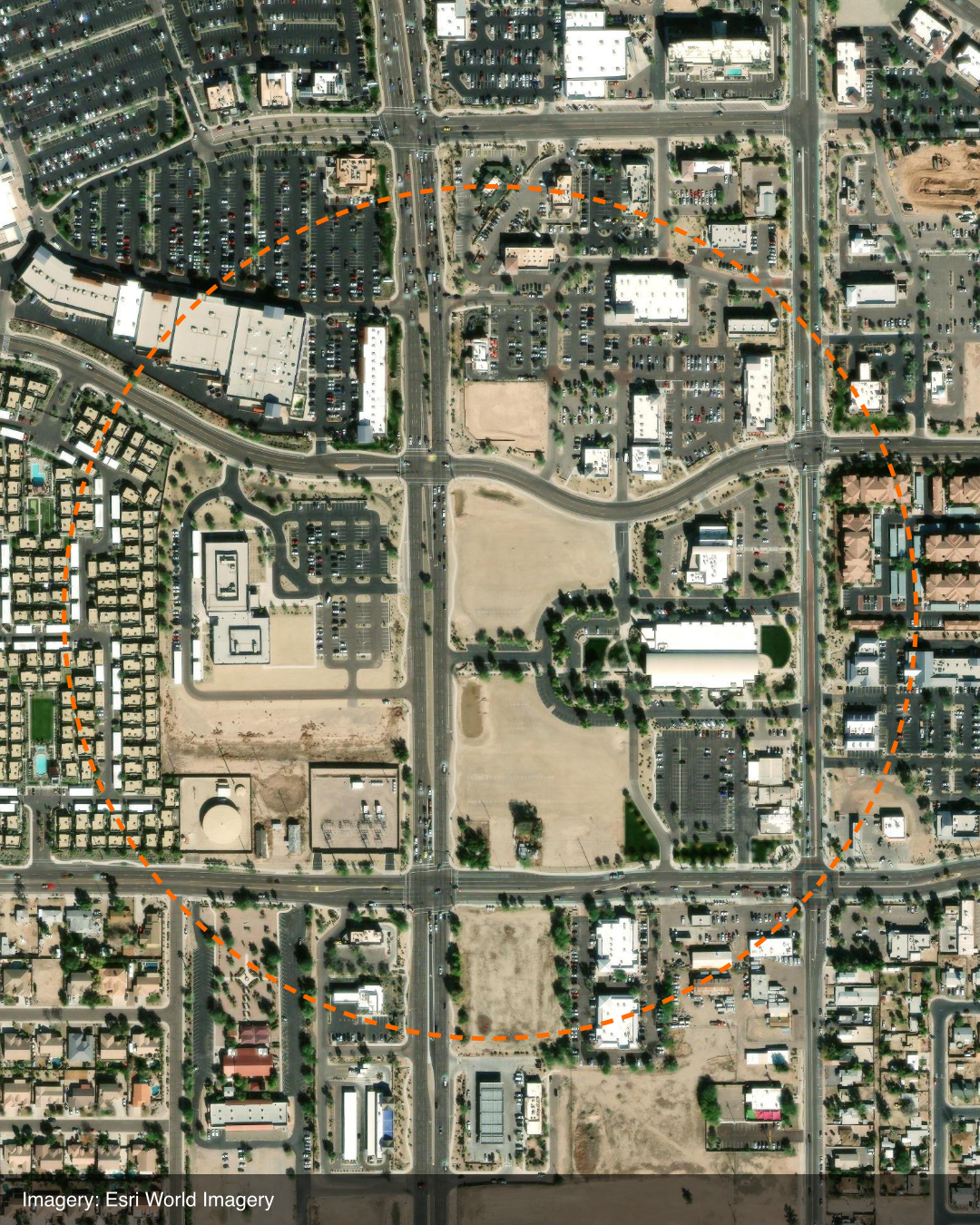 Esri World Imagery satellite aerial of the area around 21791 S Ellsworth Loop Road in Queen Creek, Arizona, with an orange dashed ellipse delineating the project parcel amid surrounding commercial and residential development